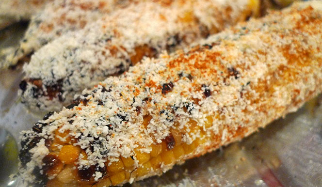 Elote a close up of a slice of pizza