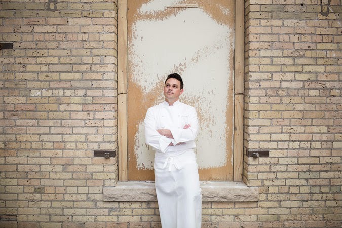 30CHEFS-master675 a person standing in front of a brick building