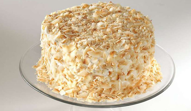 Coconut-Cake-from-Minetta-Tavern a bowl of rice on a plate