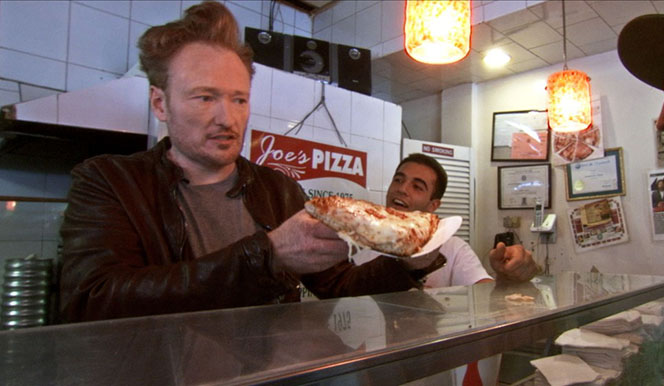 CONAN_110211_Comedy_4 Conan O'Brien preparing food in a kitchen