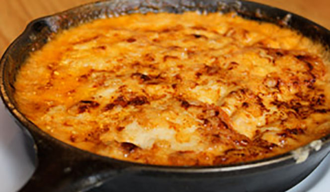 home-mac-and-cheese-recipe a close up of a pizza on a metal pan on a stove