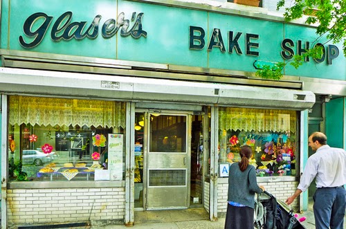 a group of people walking in front of a store