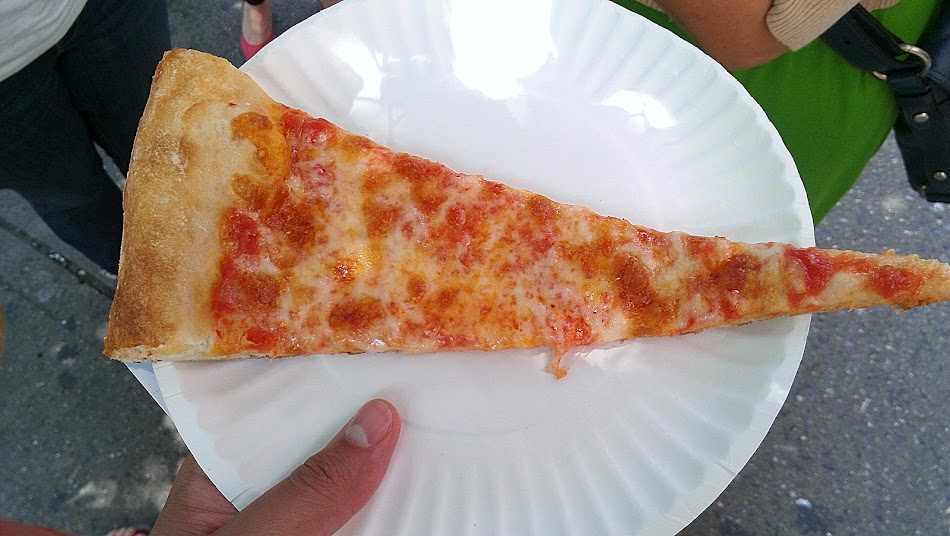 a slice of pizza on a paper plate
