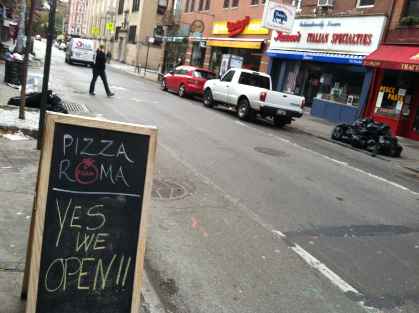 a sign on the side of the street