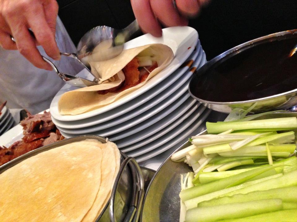 a person holding a plate of food