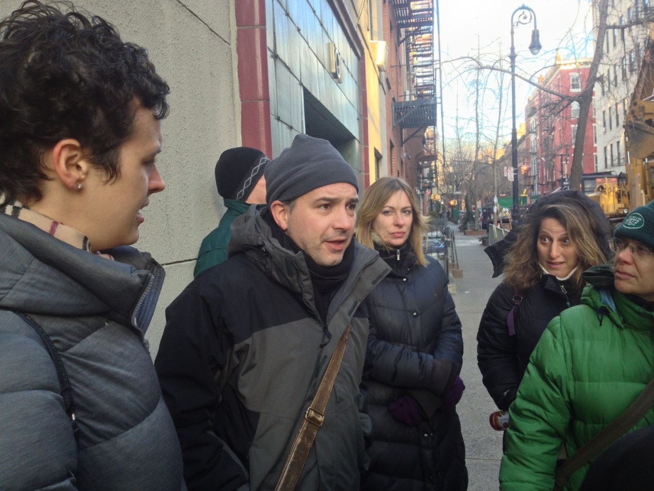 a group of people that are standing in the street