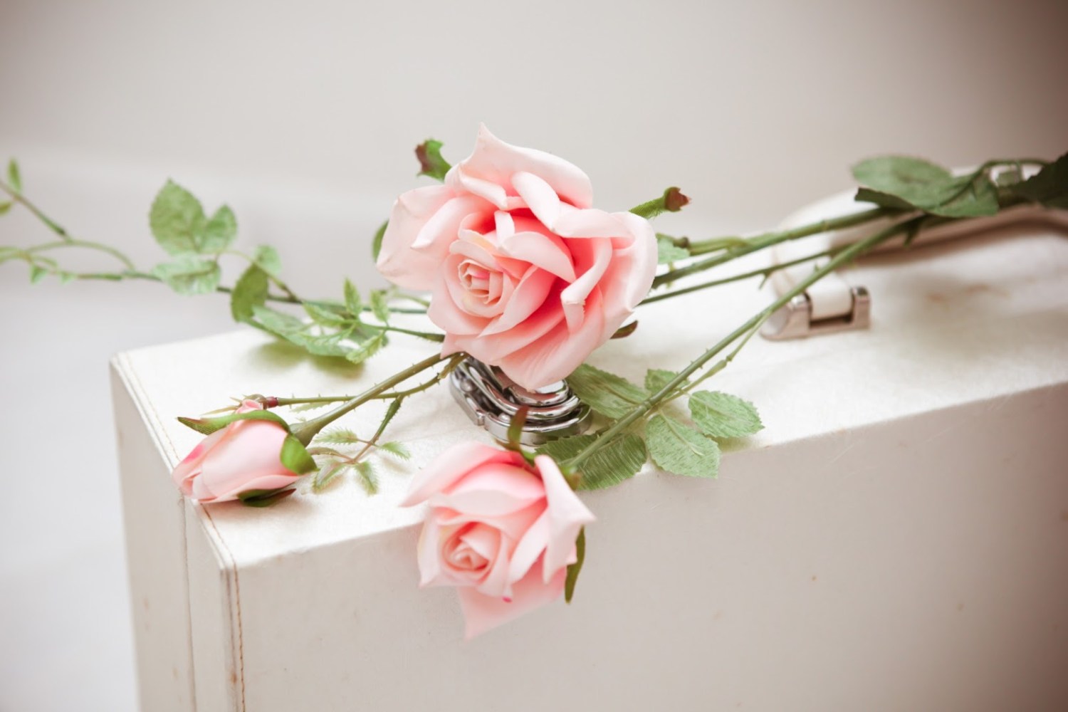 a vase filled with flowers sitting on a table