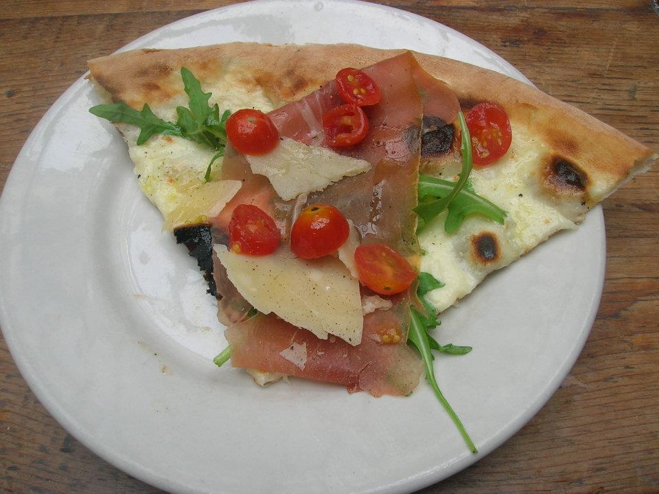 a slice of pizza on a plate