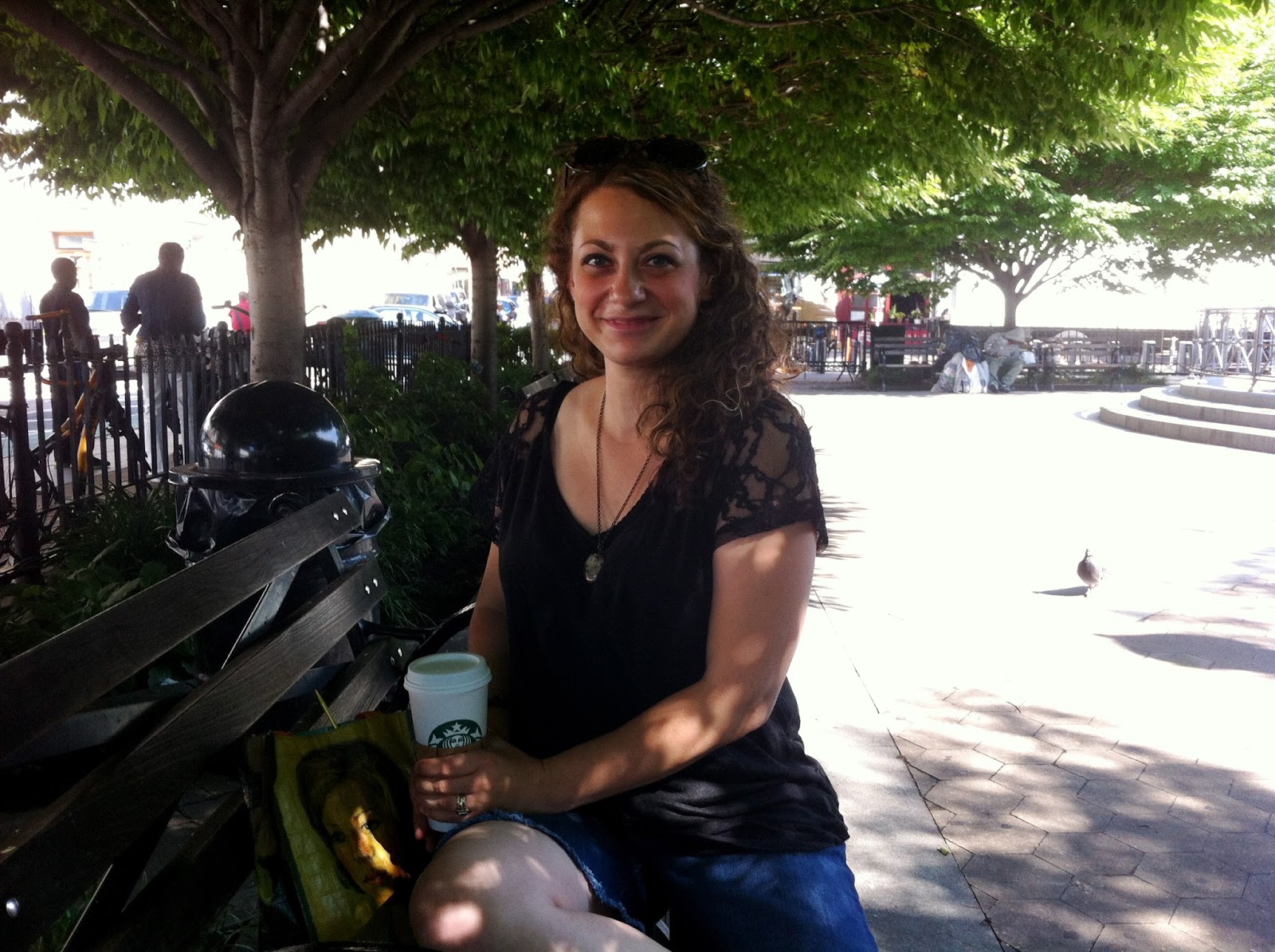 photo a person sitting on a bench posing for the camera