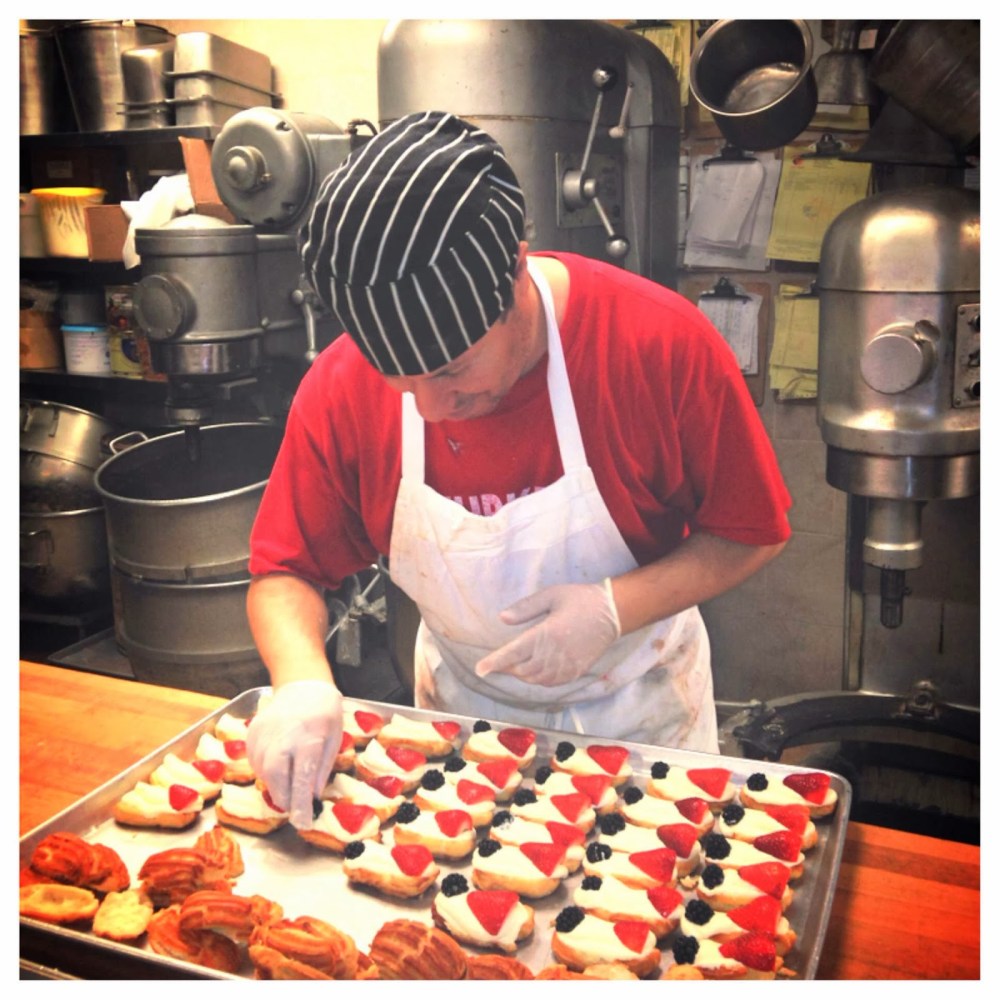 a boy is preparing food in a kitchen