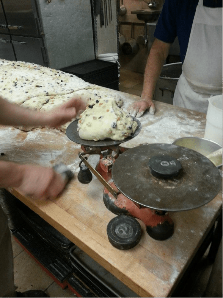 a man cooking in a kitchen preparing food