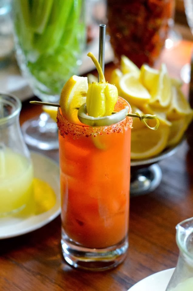 a close up of a plate of food and a glass of orange juice