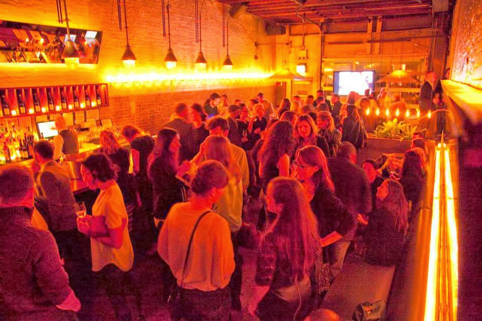 a group of people in a bar