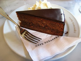 a piece of cake on a plate with a fork and knife