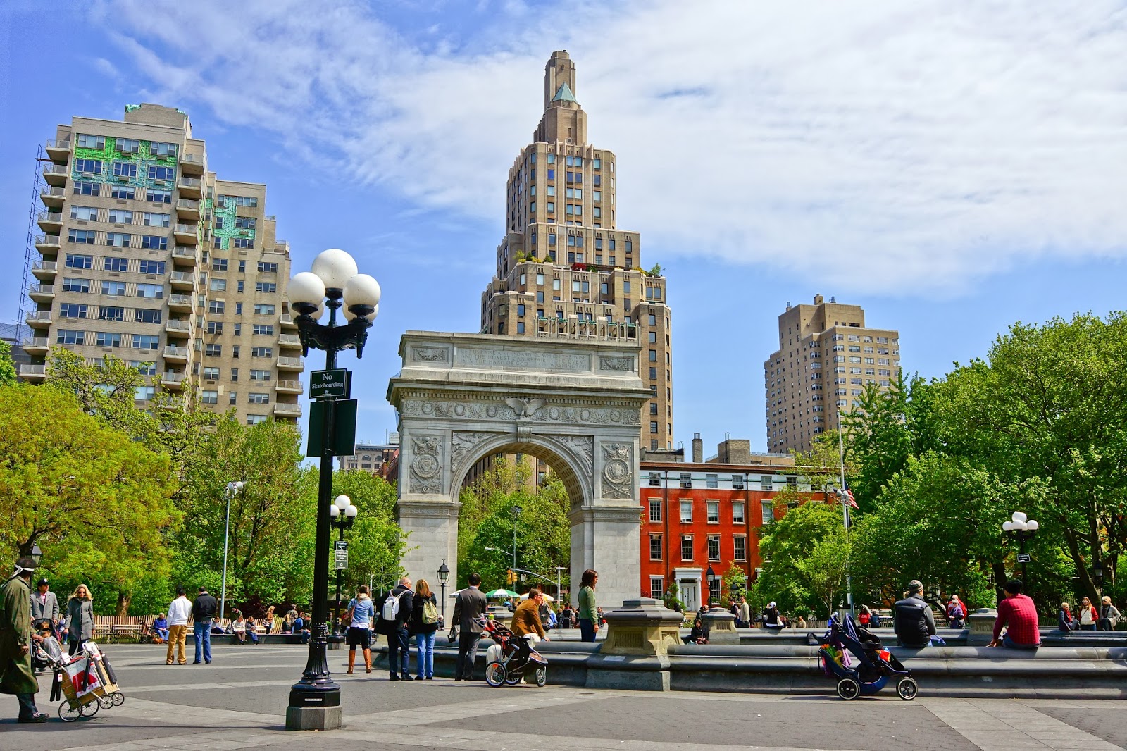 NYC_-_Washington_Square_Park a group of people walking in front of Washington Square Park