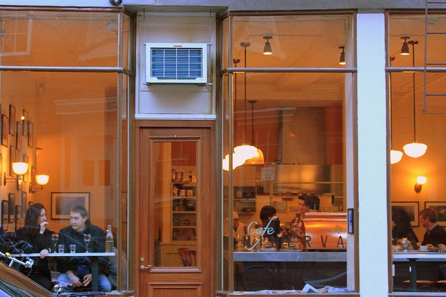 a couple of people that are standing in the kitchen