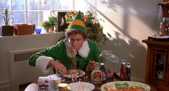 Will Ferrell sitting at a table eating food