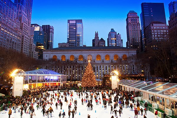a group of people standing in front of a tall building in Bryant Park