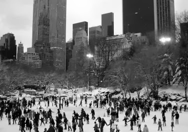 a crowd of people walking on a city street