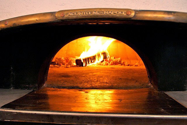 a close up of a stove top oven sitting inside of a car