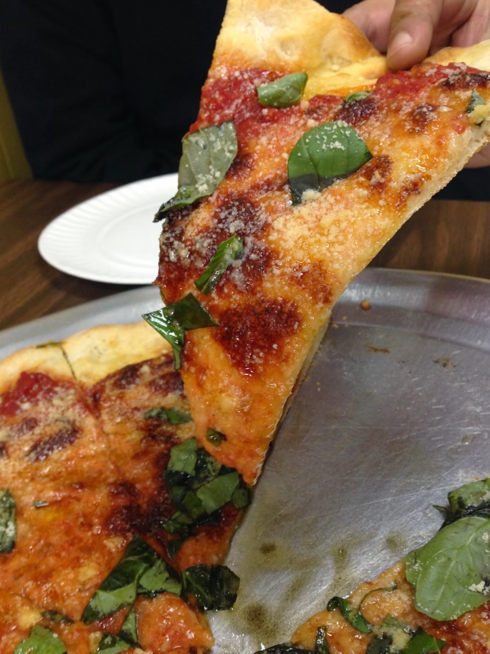 a close up of a plate of food with a slice of pizza