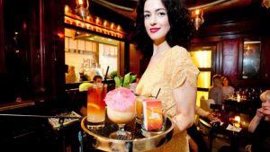 v1.4-1 a woman standing in front of a restaurant