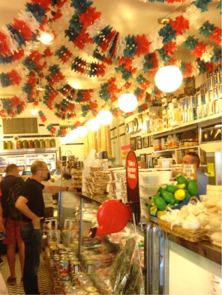 a group of people standing in front of a store