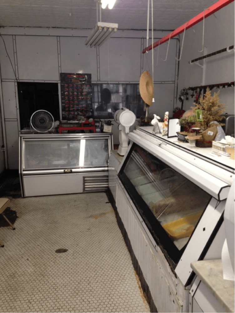 a stove top oven sitting inside of a kitchen