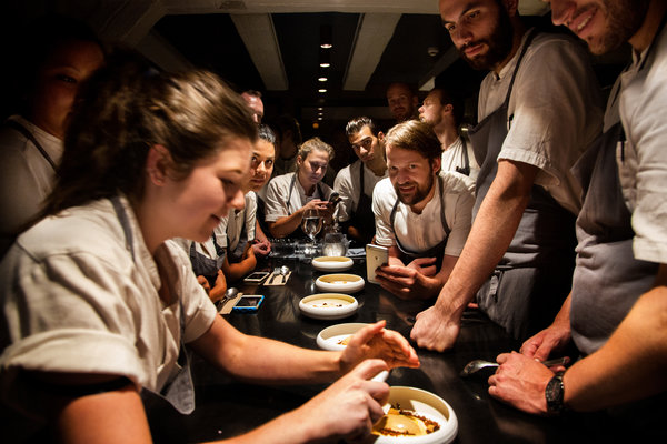 a group of people sitting at a table