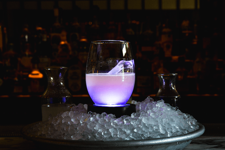 a glass of wine on a table