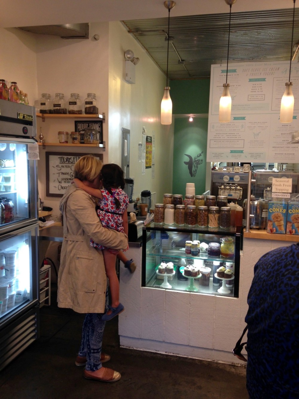 a man and a woman standing in front of a store