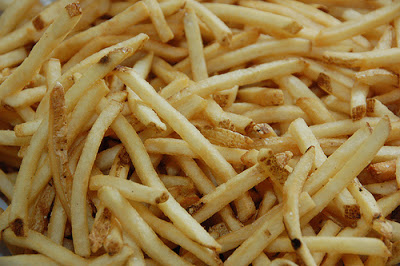 a close up of a pile of fries