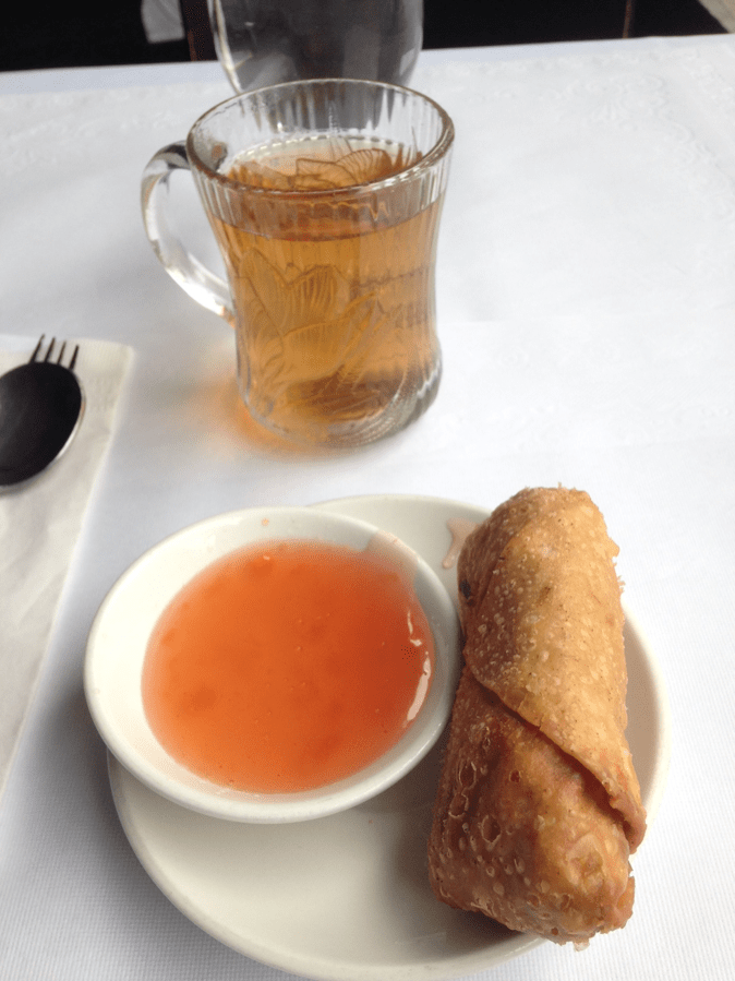 a close up of a plate of food and a cup of coffee
