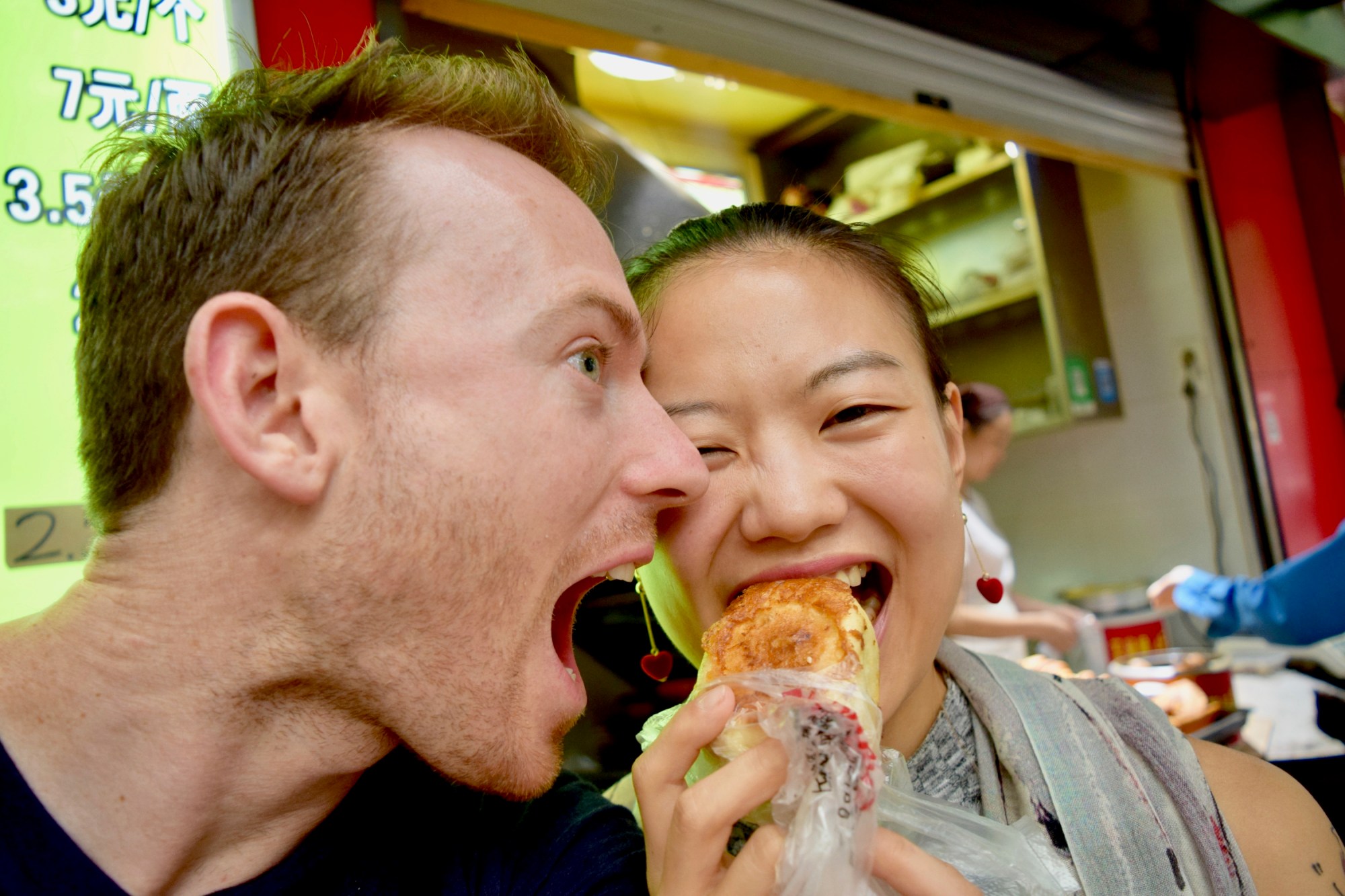 DSC_0344_50 a man eating a sandwich