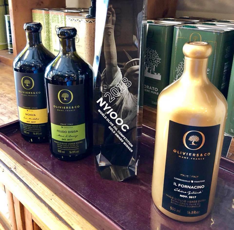 a bottle of wine and a glass of beer on a table