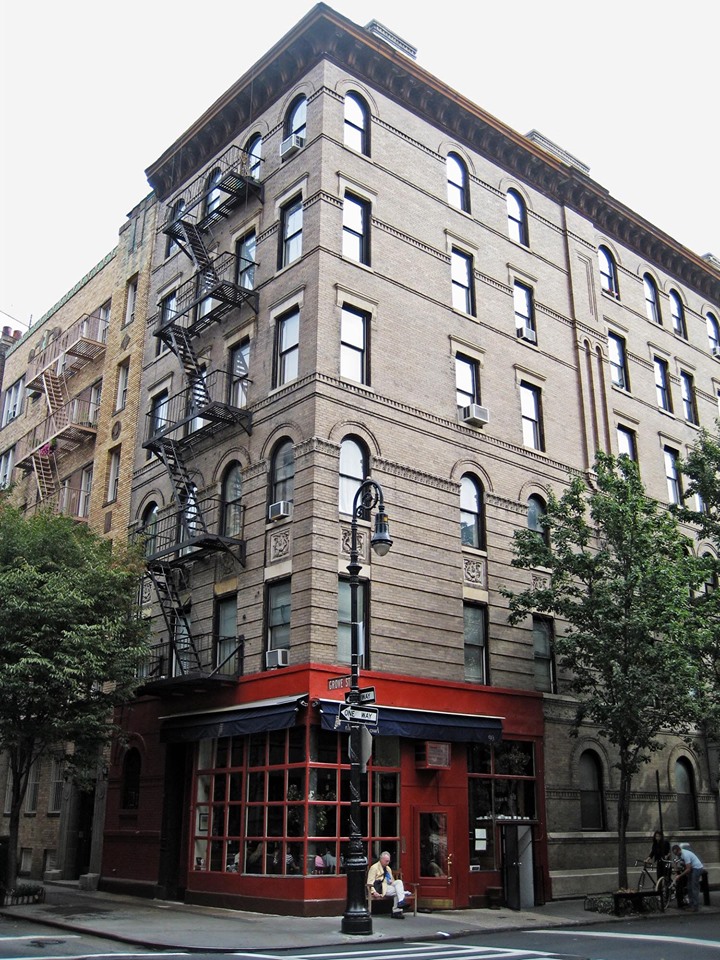 a large brick building with Greenwich Village in the background