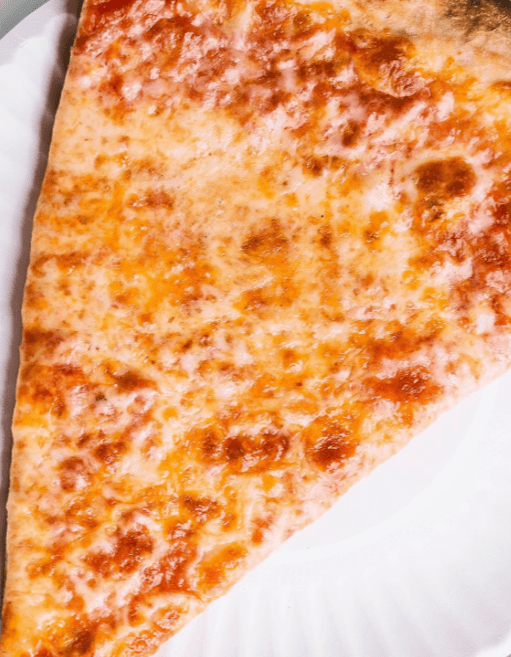 a slice of pizza on a paper plate