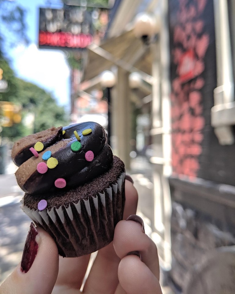 a person holding a birthday cake