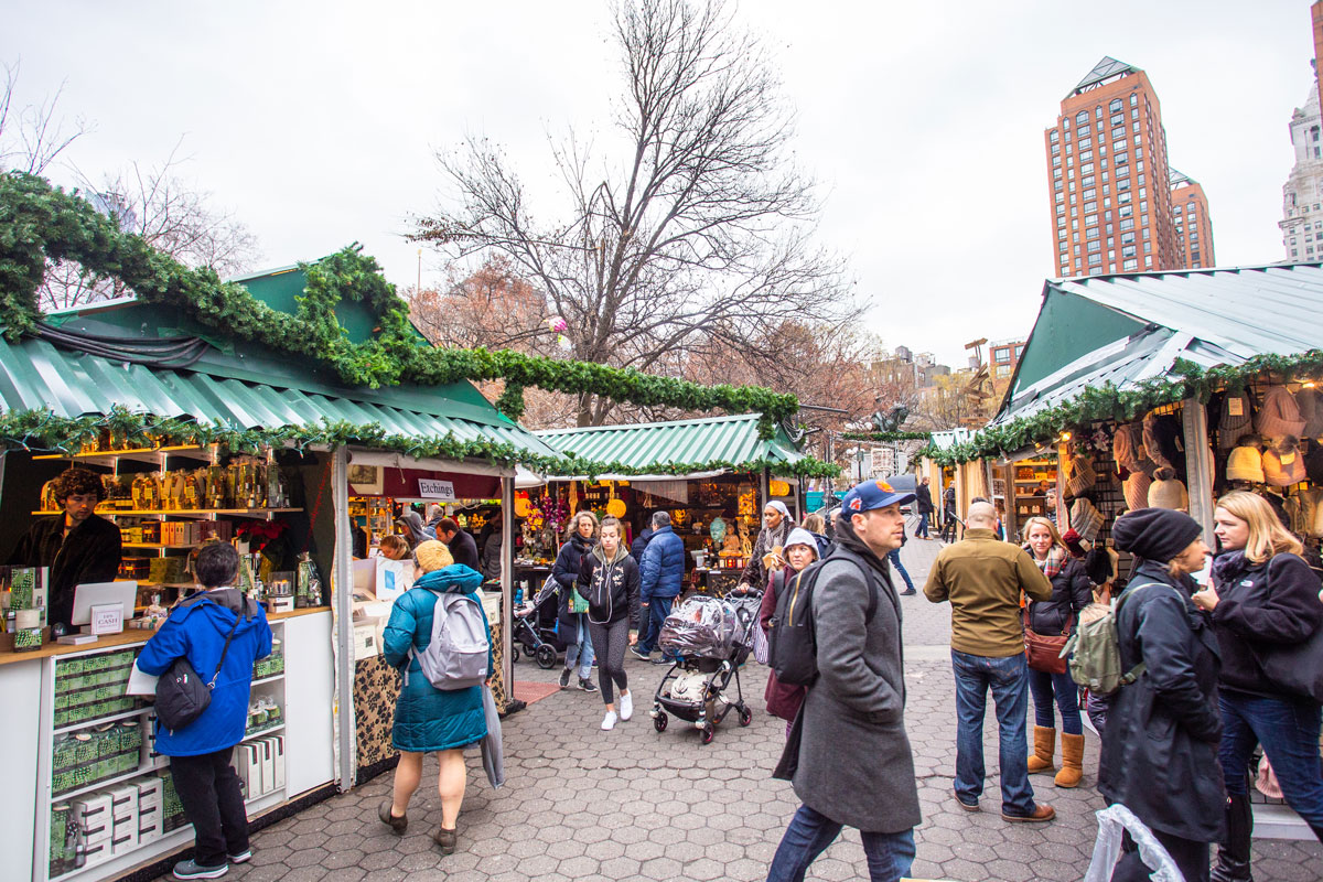 new-yorks-food-market-gems-a-must-visit-checklist-img a group of people standing in front of a crowd