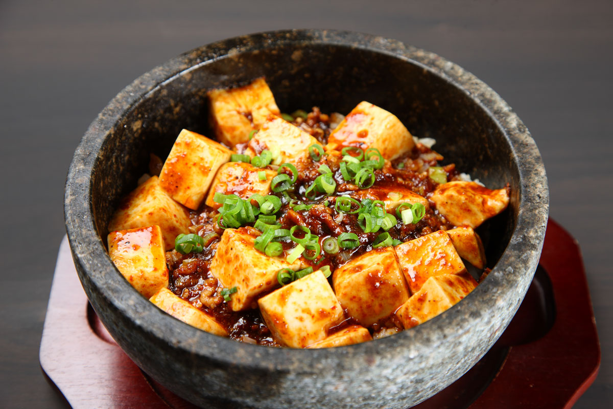 spiciest-foods-in-new-york-city-a-heat-seekers-guide-to-fiery-cuisine-img a bowl of food with stew