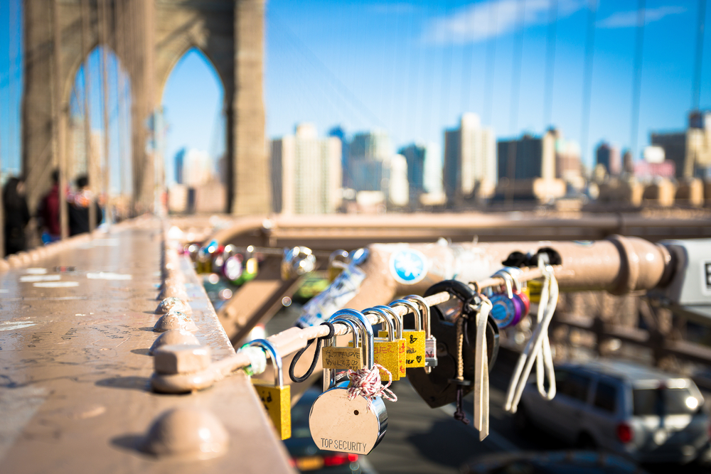 Brooklyn Bridge, New York, USA a glass of water on a table