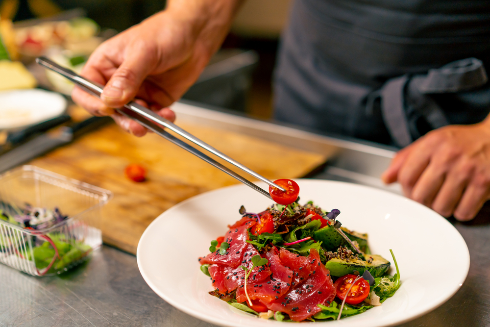 x-vegetarian-restaurants-youll-love-in-nolita a woman sitting at a table with a plate of food