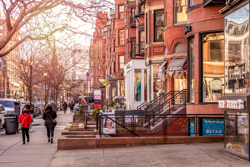nolita-vs-soho-exploring-new-yorks-trendiest-district a group of people on a sidewalk