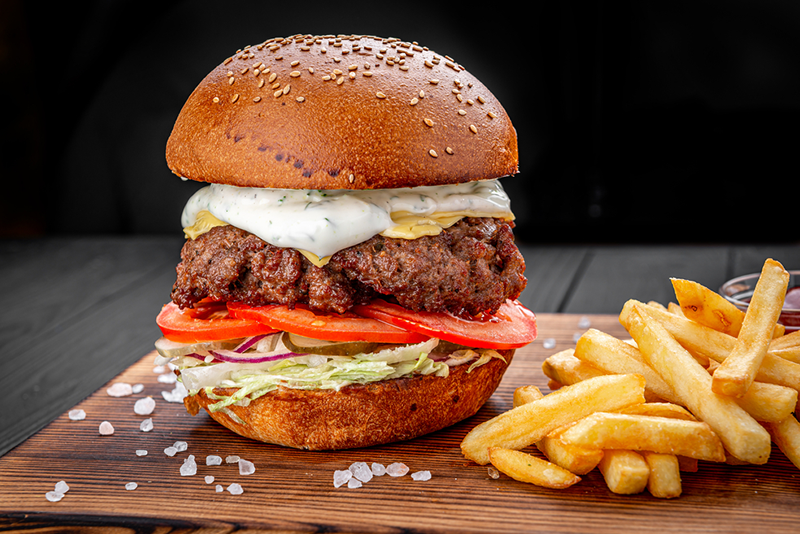 x-best-burgers-in-nyc-thatll-blow-your-mind1 a sandwich and fries on a table