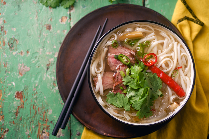 nycs-4-best-pho-restaurants-for-your-soupy a bowl of salad on a plate