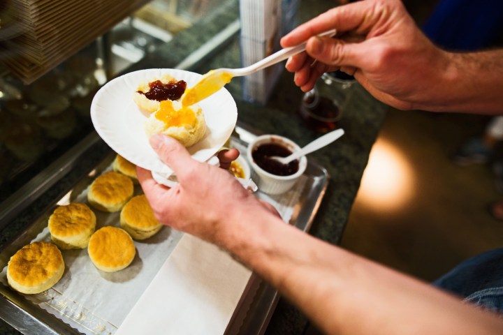 a woman holding a plate of food