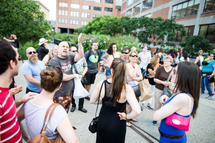 a group of people standing in front of a crowd