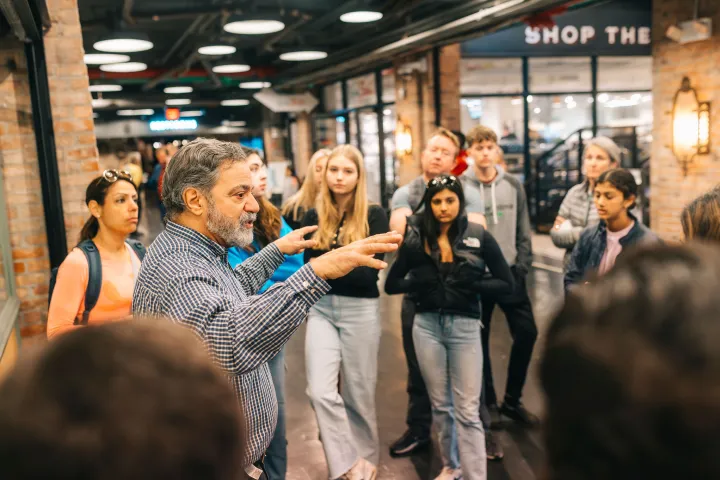 a group of people standing in front of a building