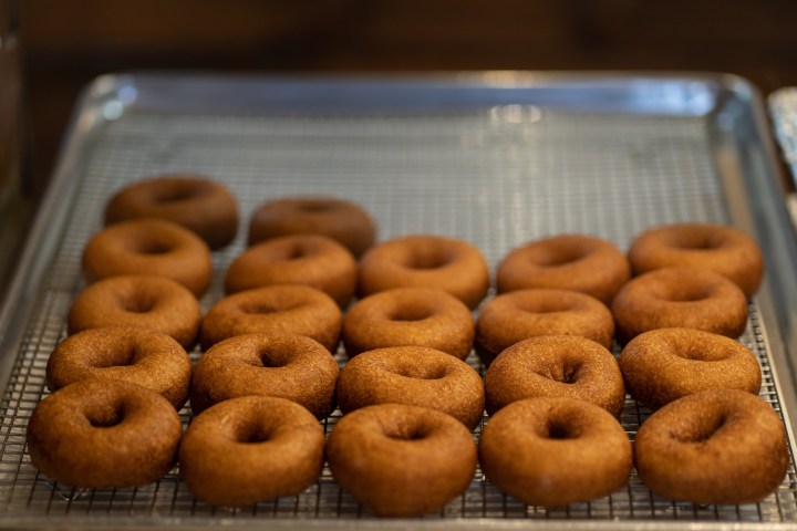 a donut sitting on top of a metal rack