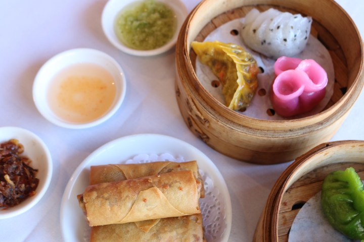 a bowl filled with different types of food on a plate